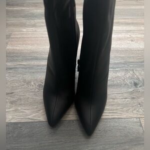 Tall black heeled boots